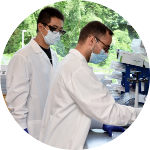 Two men working in a lab onsite doing research.